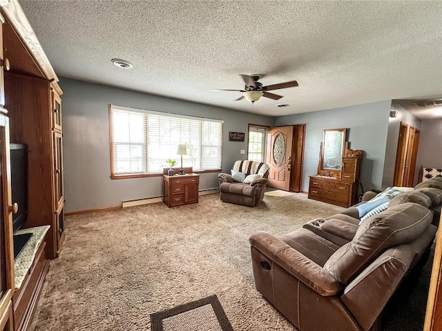 619 Cleveland St, Paris, MO 65275 - living area featuring a ceiling fan, baseboard heating, light colored carpet, baseboards, and a textured ceiling