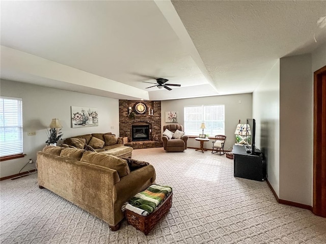 619 Cleveland St, Paris, MO 65275 - living area featuring baseboards, light carpet, ceiling fan, and a brick fireplace