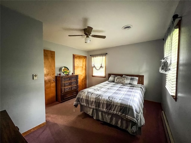 619 Cleveland St, Paris, MO 65275 - bedroom with carpet floors, ceiling fan, and a baseboard heating unit