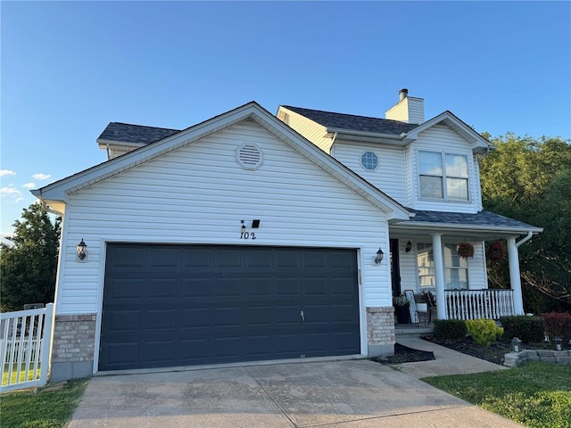 102 Riverview Bend Estates Dr, Crystal City, MO 63019 - traditional-style house with covered porch, an attached garage, driveway, a chimney, and stone siding