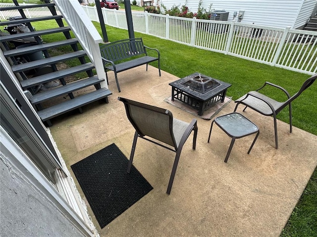 102 Riverview Bend Estates Dr, Crystal City, MO 63019 - view of patio / terrace with a fire pit, central AC, and stairs