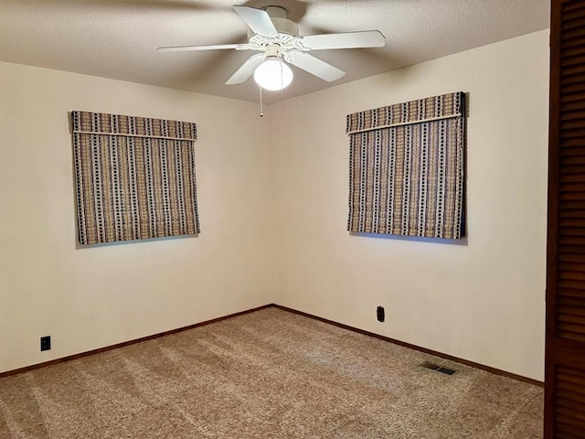 16463 Terrace Dr, Dexter, MO 63841 - empty room featuring carpet floors, a ceiling fan, and baseboards