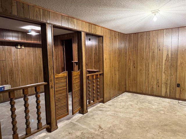 16463 Terrace Dr, Dexter, MO 63841 - corridor featuring wood walls and a textured ceiling