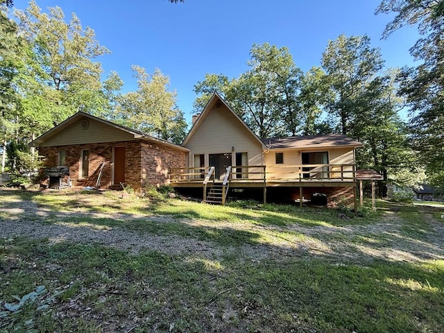 16463 Terrace Dr, Dexter, MO 63841 - rear view of property with a wooden deck and a lawn