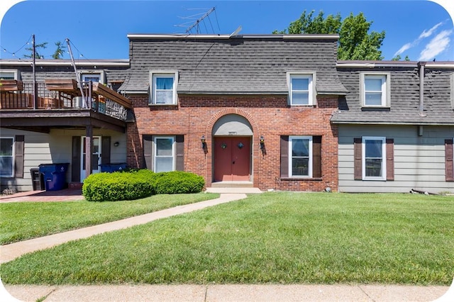 6691 Parker Rd Unit A, Florissant, MO 63033 - view of front of property with roof with shingles, brick siding, and mansard roof