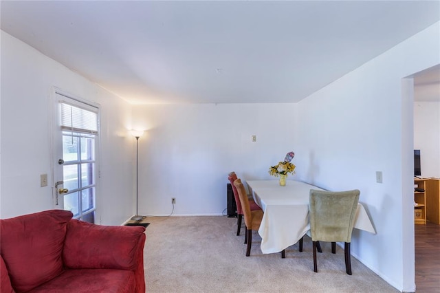 6691 Parker Rd Unit A, Florissant, MO 63033 - dining space featuring carpet and baseboards