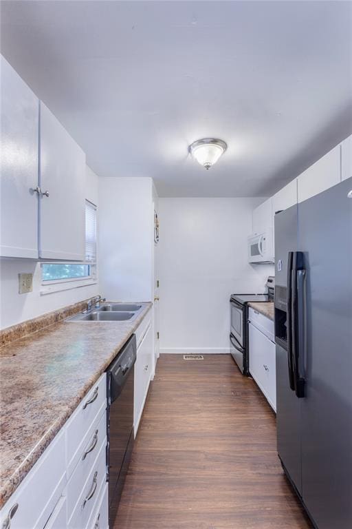 6691 Parker Rd Unit A, Florissant, MO 63033 - kitchen with refrigerator with ice dispenser, stainless steel range with electric cooktop, dishwasher, white microwave, and white cabinetry