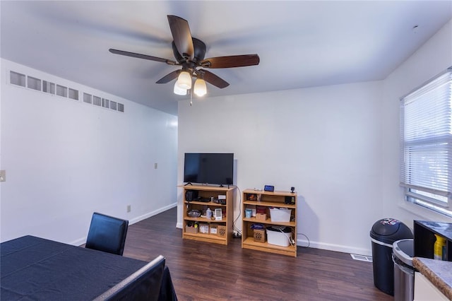 6691 Parker Rd Unit A, Florissant, MO 63033 - dining area featuring wood finished floors, a ceiling fan, and baseboards