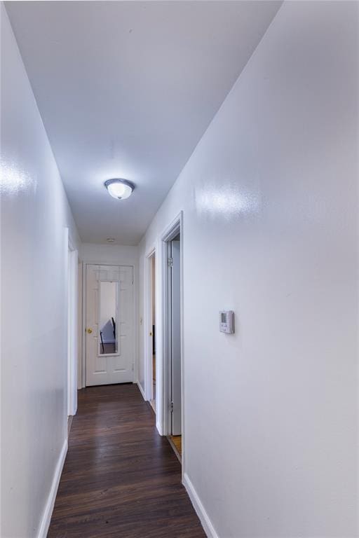 6691 Parker Rd Unit A, Florissant, MO 63033 - corridor with baseboards and dark wood-style floors