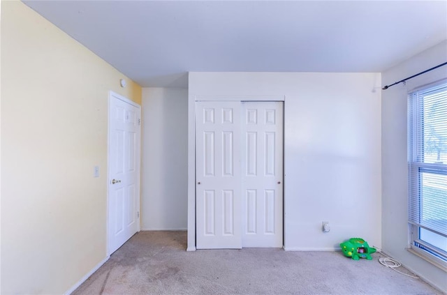 6691 Parker Rd Unit A, Florissant, MO 63033 - unfurnished bedroom with carpet, a closet, and baseboards