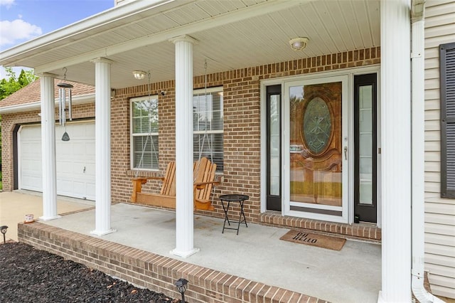 1519 Progress Ln, Belleville, IL 62221 - property entrance featuring brick siding, covered porch, and an attached garage