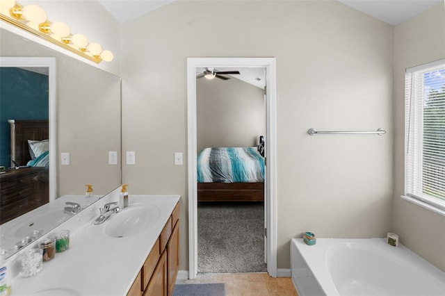 1519 Progress Ln, Belleville, IL 62221 - bathroom featuring connected bathroom, vanity, a garden tub, ceiling fan, and lofted ceiling