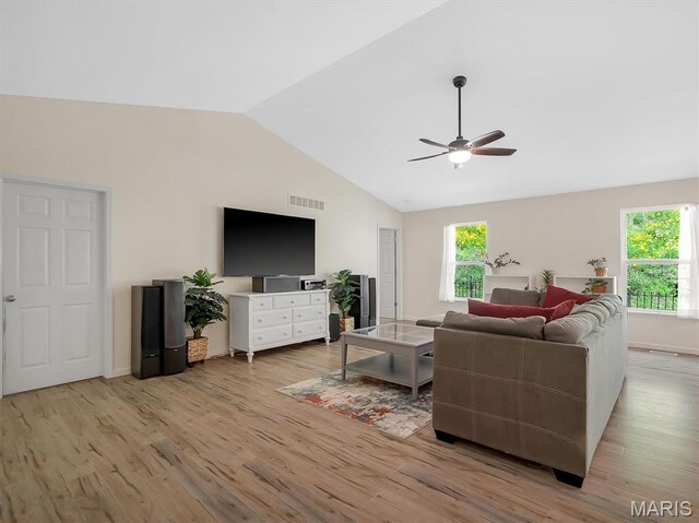 1109 Foxwood Estates Dr, Arnold, MO 63010 - living room featuring vaulted ceiling, light wood-type flooring, ceiling fan, and baseboards