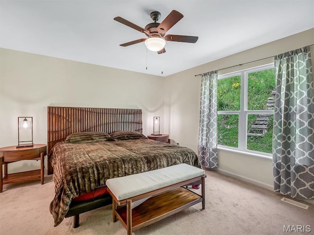 1109 Foxwood Estates Dr, Arnold, MO 63010 - bedroom with light carpet, baseboards, and a ceiling fan