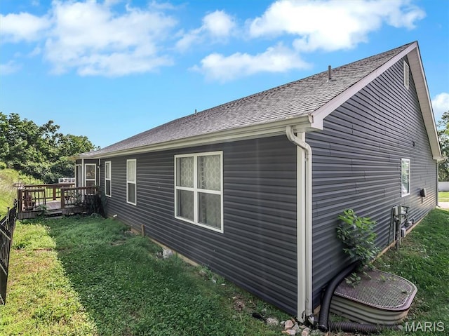 1109 Foxwood Estates Dr, Arnold, MO 63010 - view of home's exterior with a deck, a yard, and a shingled roof
