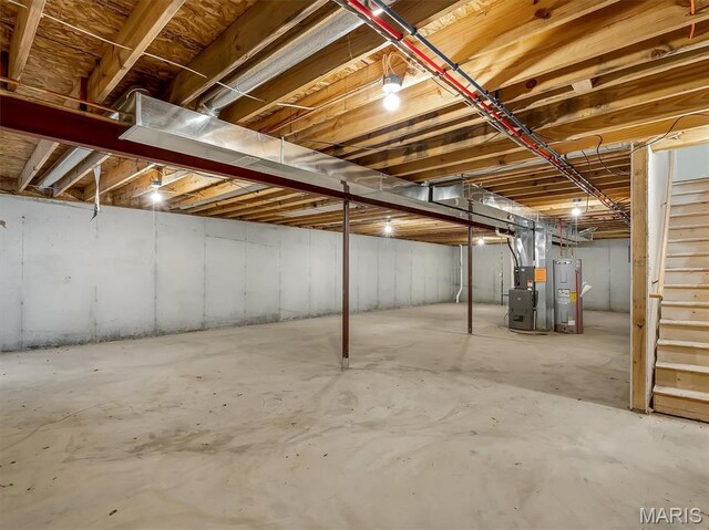 1109 Foxwood Estates Dr, Arnold, MO 63010 - unfinished below grade area with stairway, water heater, and heating unit