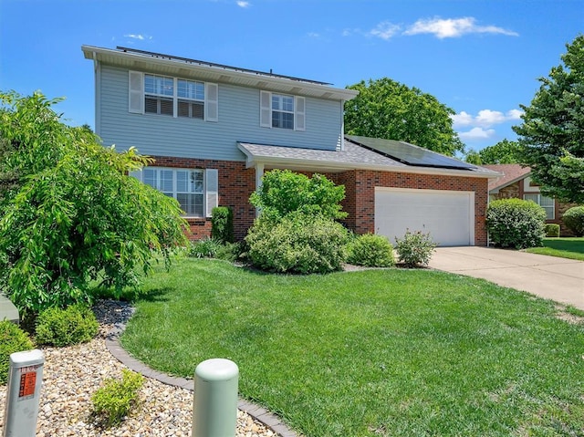 1102 Affirm Dr, Ofallon, IL 62269 - traditional-style house featuring roof mounted solar panels, brick siding, a front lawn, and concrete driveway