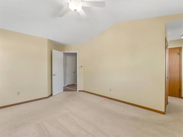 1102 Affirm Dr, Ofallon, IL 62269 - spare room featuring light colored carpet, lofted ceiling, baseboards, and ceiling fan