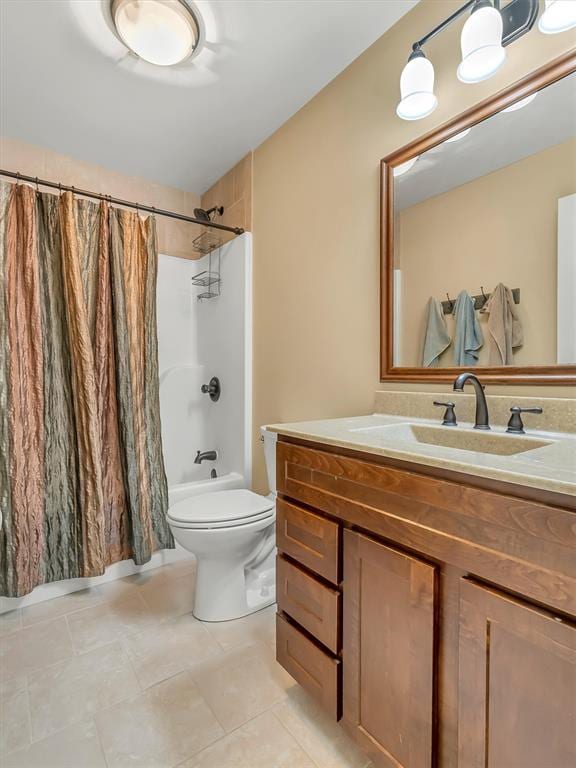 1102 Affirm Dr, Ofallon, IL 62269 - bathroom featuring vanity, shower / bath combo with shower curtain, toilet, and tile patterned floors
