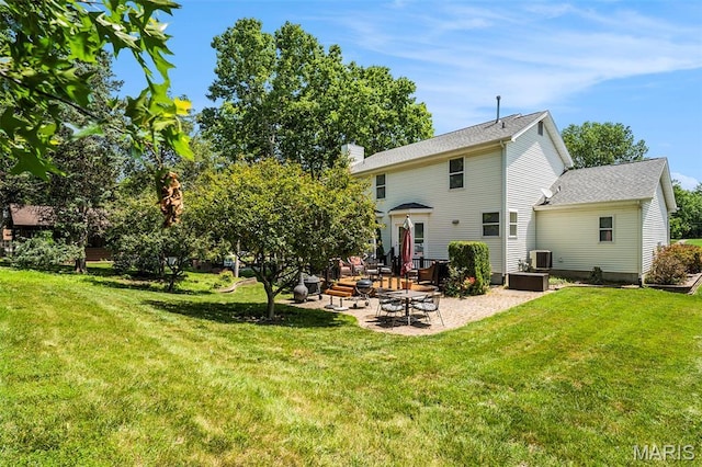 1575 Uthoff Dr, Fenton, MO 63026 - back of house with a patio area, a yard, a chimney, and roof with shingles