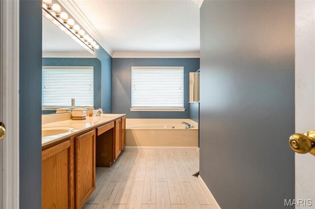 1575 Uthoff Dr, Fenton, MO 63026 - bathroom with a bath, wood finished floors, plenty of natural light, double vanity, and ornamental molding