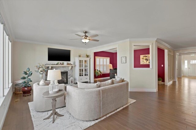 1355 Bloomfield Dr, Eureka, MO 63025 - living room with a fireplace, wood finished floors, ceiling fan, baseboards, and crown molding