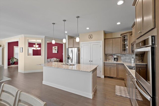 1355 Bloomfield Dr, Eureka, MO 63025 - kitchen featuring appliances with stainless steel finishes, a sink, baseboards, decorative backsplash, and glass insert cabinets