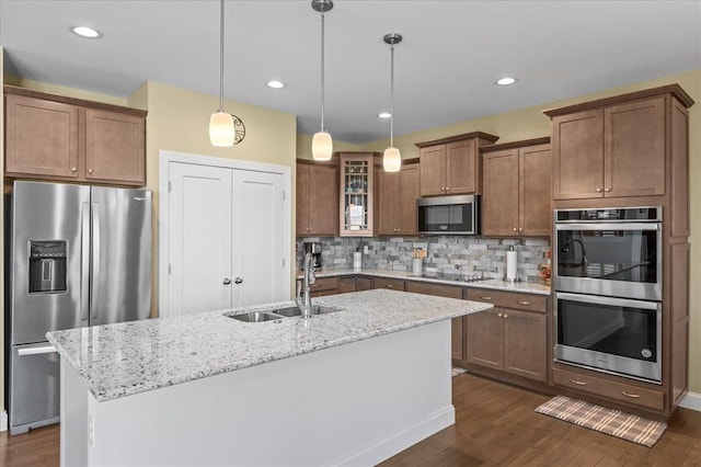 1355 Bloomfield Dr, Eureka, MO 63025 - kitchen with stainless steel appliances, a sink, dark wood-type flooring, decorative backsplash, and recessed lighting