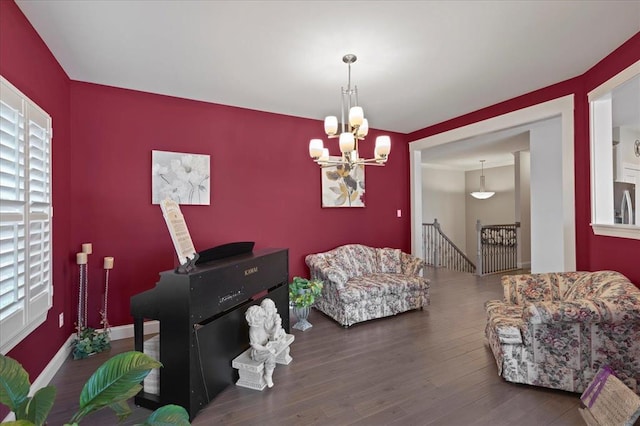 1355 Bloomfield Dr, Eureka, MO 63025 - living room with a chandelier, wood finished floors, and baseboards