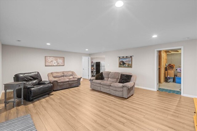 1355 Bloomfield Dr, Eureka, MO 63025 - living area with light wood-type flooring, recessed lighting, and baseboards