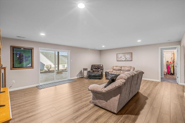 1355 Bloomfield Dr, Eureka, MO 63025 - living area with light wood finished floors, baseboards, and recessed lighting