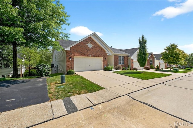 1423 Villas Estates Dr, Saint Louis, MO 63026 - view of front of home featuring brick siding, driveway, a garage, and a front lawn