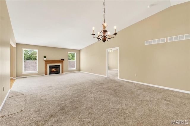 1423 Villas Estates Dr, Saint Louis, MO 63026 - unfurnished living room featuring vaulted ceiling, a chandelier, carpet floors, and a fireplace with flush hearth