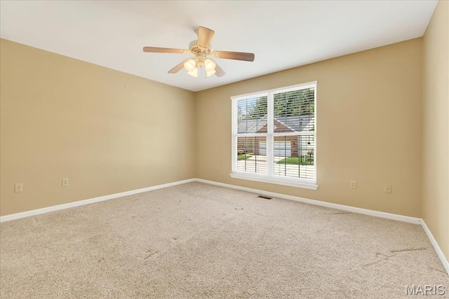 1423 Villas Estates Dr, Saint Louis, MO 63026 - carpeted spare room featuring baseboards and a ceiling fan