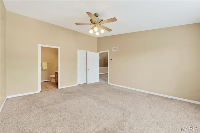 1423 Villas Estates Dr, Saint Louis, MO 63026 - unfurnished bedroom featuring light colored carpet, connected bathroom, and ceiling fan