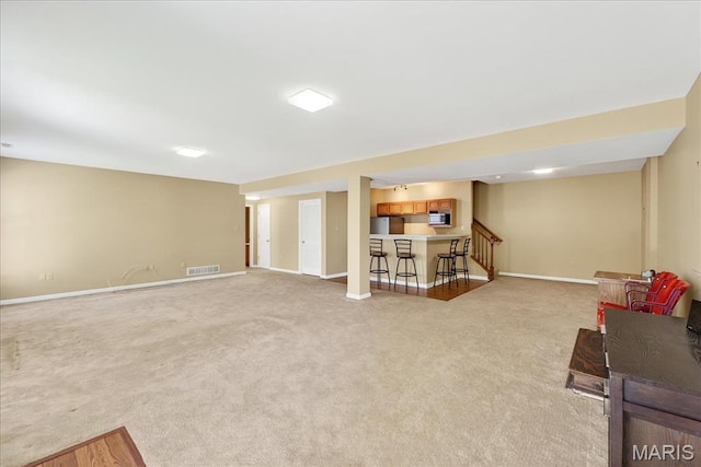 1423 Villas Estates Dr, Saint Louis, MO 63026 - living area featuring light colored carpet and stairs