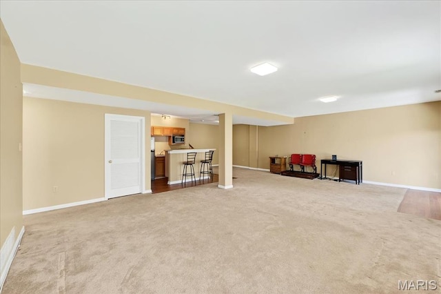 1423 Villas Estates Dr, Saint Louis, MO 63026 - finished basement with carpet flooring, bar, and fridge