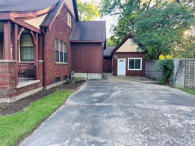 417 S Kingshighway St, Sikeston, MO 63801 - view of property exterior with brick siding and roof with shingles