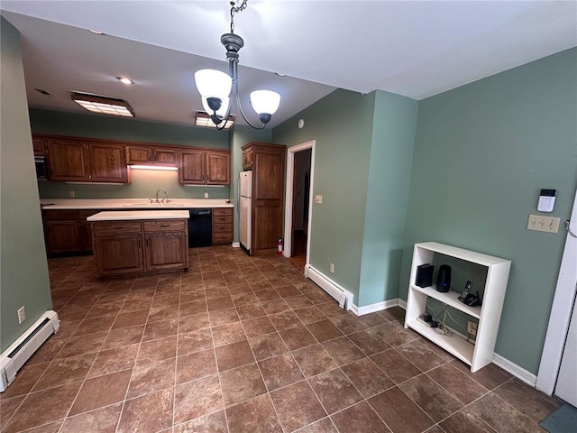 417 S Kingshighway St, Sikeston, MO 63801 - kitchen featuring freestanding refrigerator, baseboard heating, a baseboard heating unit, light countertops, and a sink