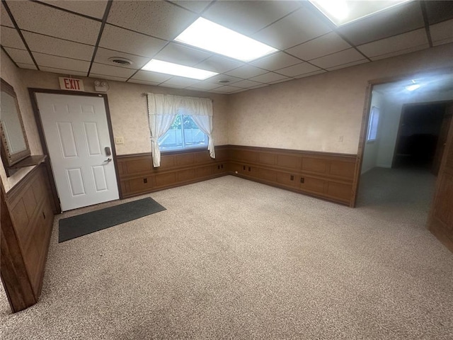 417 S Kingshighway St, Sikeston, MO 63801 - spare room with a drop ceiling, a wainscoted wall, and light carpet
