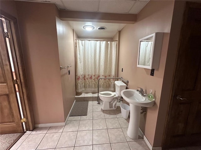 417 S Kingshighway St, Sikeston, MO 63801 - full bathroom with toilet, tile patterned floors, baseboards, and a stall shower
