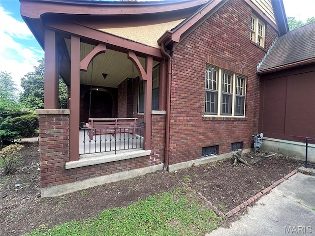 417 S Kingshighway St, Sikeston, MO 63801 - property entrance featuring covered porch and brick siding