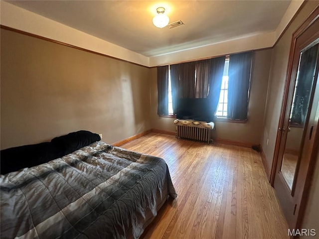 417 S Kingshighway St, Sikeston, MO 63801 - bedroom with radiator and light wood finished floors