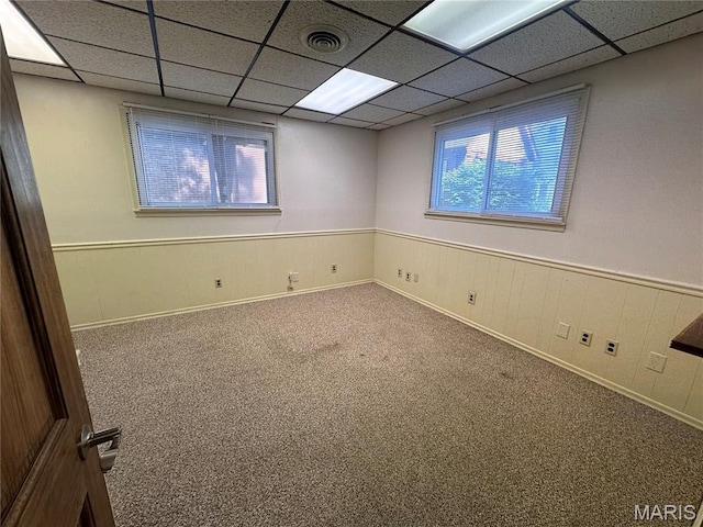 417 S Kingshighway St, Sikeston, MO 63801 - unfurnished room with a wainscoted wall, carpet floors, and a paneled ceiling