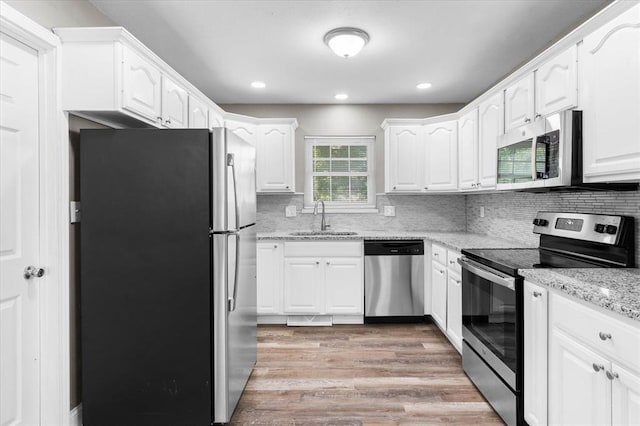 113 Brand Ave, Red Bud, IL 62278 - kitchen with appliances with stainless steel finishes, a sink, white cabinetry, and recessed lighting