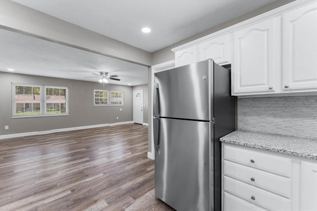113 Brand Ave, Red Bud, IL 62278 - kitchen with freestanding refrigerator, backsplash, white cabinets, baseboards, and recessed lighting