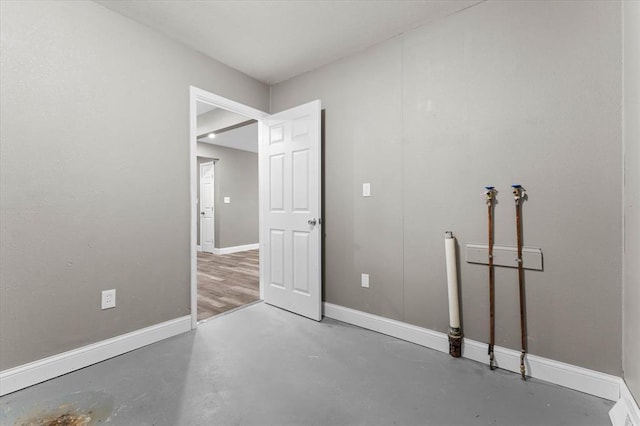 113 Brand Ave, Red Bud, IL 62278 - unfurnished bedroom featuring concrete flooring and baseboards