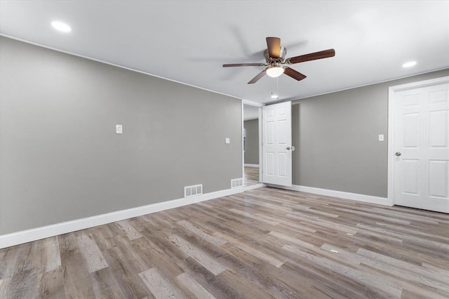 113 Brand Ave, Red Bud, IL 62278 - empty room with wood finished floors, ceiling fan, recessed lighting, and baseboards