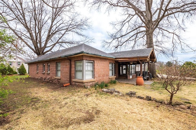12810 Big Bend Rd, Kirkwood, MO 63122 - view of property exterior featuring a shingled roof and a lawn
