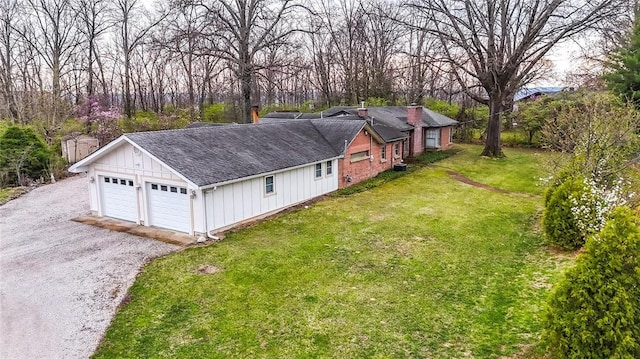 12810 Big Bend Rd, Kirkwood, MO 63122 - view of home's exterior featuring roof with shingles, a yard, board and batten siding, and a chimney